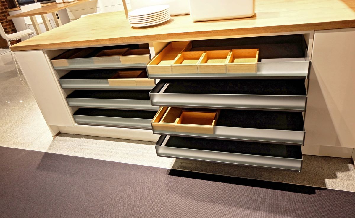 Drawer and cutlery tray for organizing kitchen equipment.